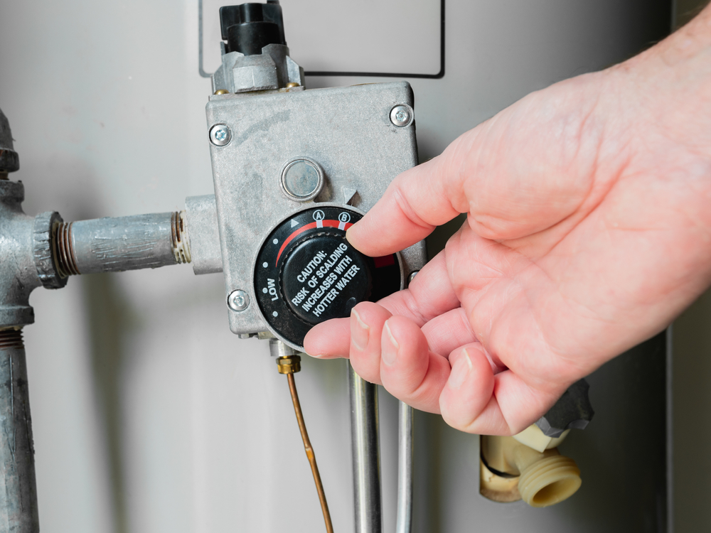  A temperature control knob for a conventional water heater.